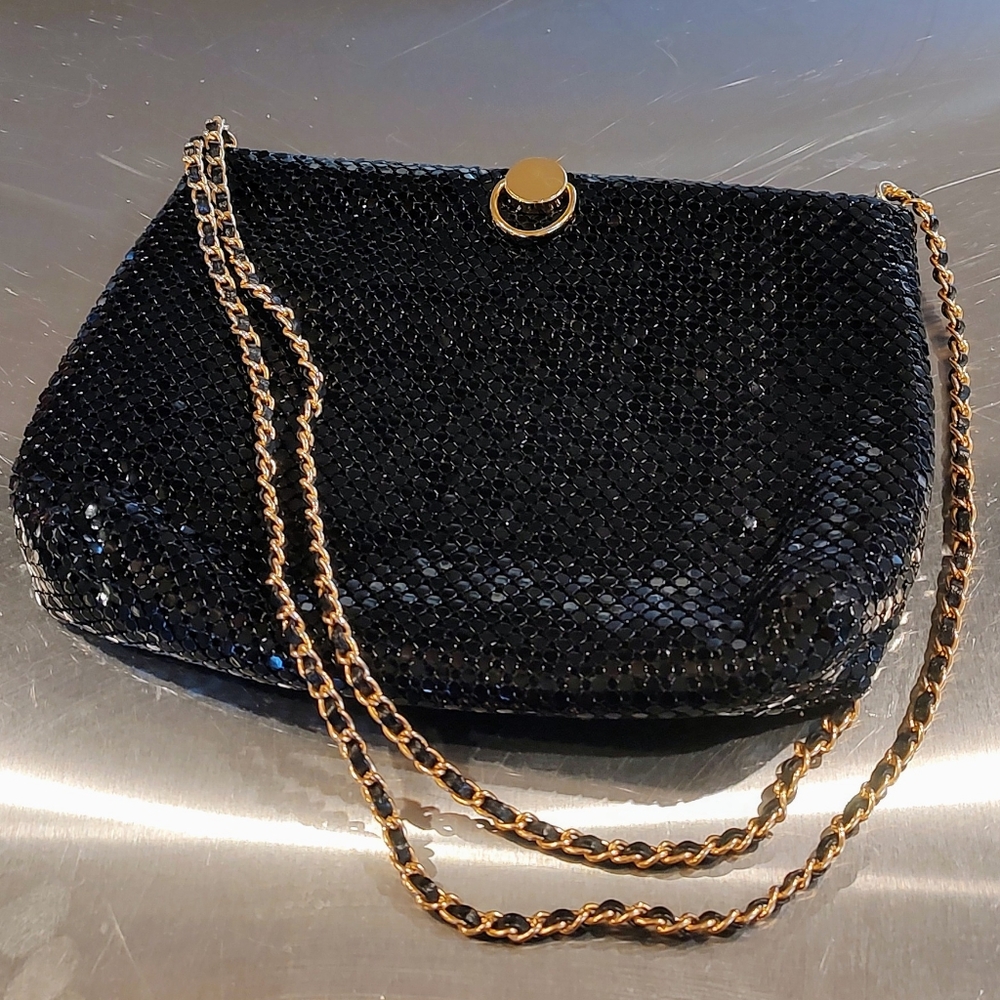 Sparkly black chainmail bag with gold tone hardware. Pre-owned.